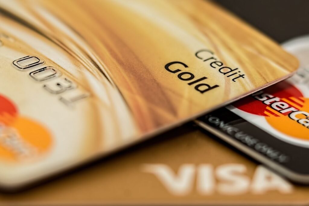 Credit cards and a calculator on a table for comparing debt payoff options