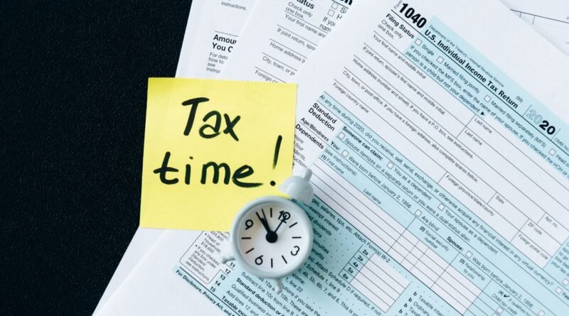 Tax documents on a black table