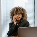 Woman calling her credit card company from a home office to ask for a lower APR