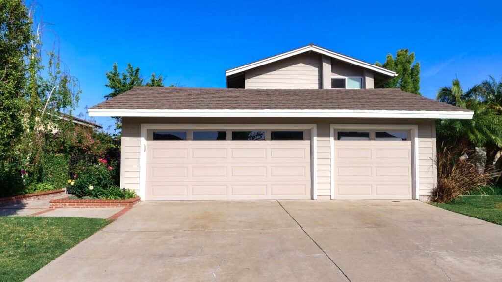 Exterior view of a cozy suburban house with a double garage