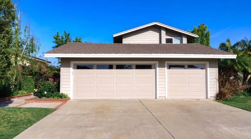 Exterior view of a cozy suburban house with a double garage